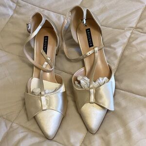 Cream Pointed-Toe Bow Ankle-Strap Flats